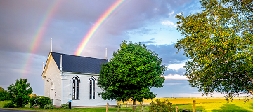 Rainbow over church