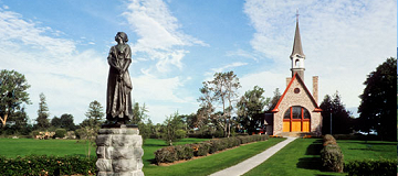 Evangeline statue with church in background
