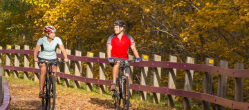 Couple biking on trail